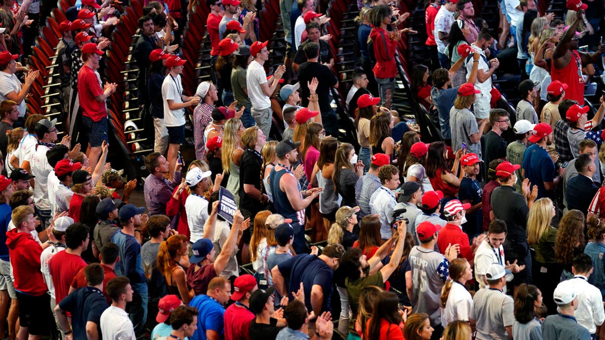 Supporters listen as President Trump speaks to a group of young Republicans at Dream City Church, Tuesday, June 23, 2020, in Phoenix. (AP Photo/Evan Vucci)