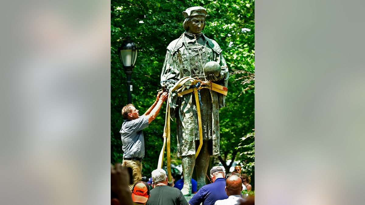 A statue of Christopher Columbus is removed from Wooster Square Park in New Haven, Conn., Wednesday, June 24, 2020. (Associated Press)