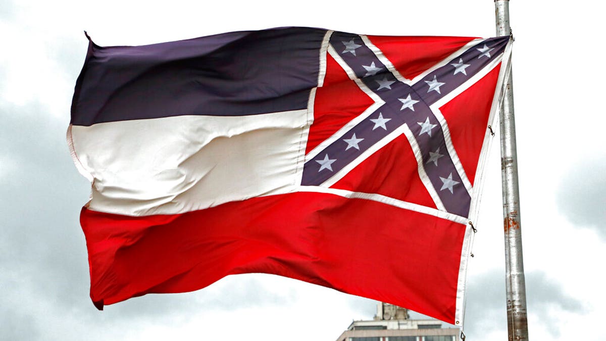 <br>
​​​​The recently retired Mississippi state flag flies outside the Statehouse in Jackson, June 25, 2020. (Associated Press)