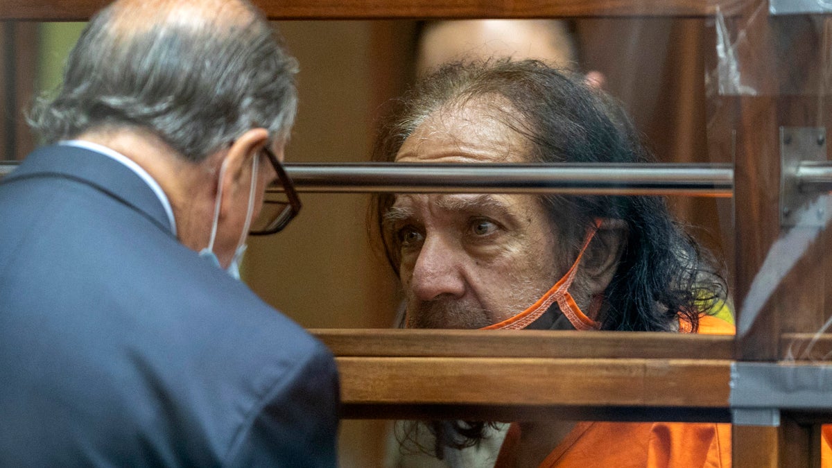 Adult film star Ron Jeremy talks with his attorney Stuart Goldfarb during his arraignment on rape and sexual assault charges at Clara Shortridge Foltz Criminal Justice Center, Friday, June 26, 2020, in Los Angeles.