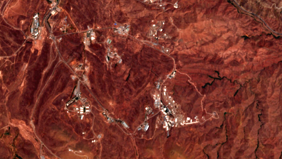 This June 21, 2020 photo from the European Commission's Sentinel-2 satellite shows a site before an explosion June 26, 2020, that rattled Iran’s capital. Analysts say the blast came from an area in Tehran’s eastern mountains they hides a underground tunnel system and missile production sites. (European Commission via AP)