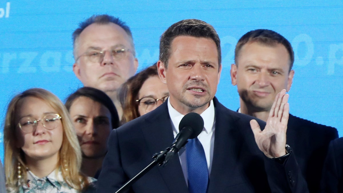 Warsaw Mayor Rafal Trzaskowski, front, reacting to the exit poll Sunday.