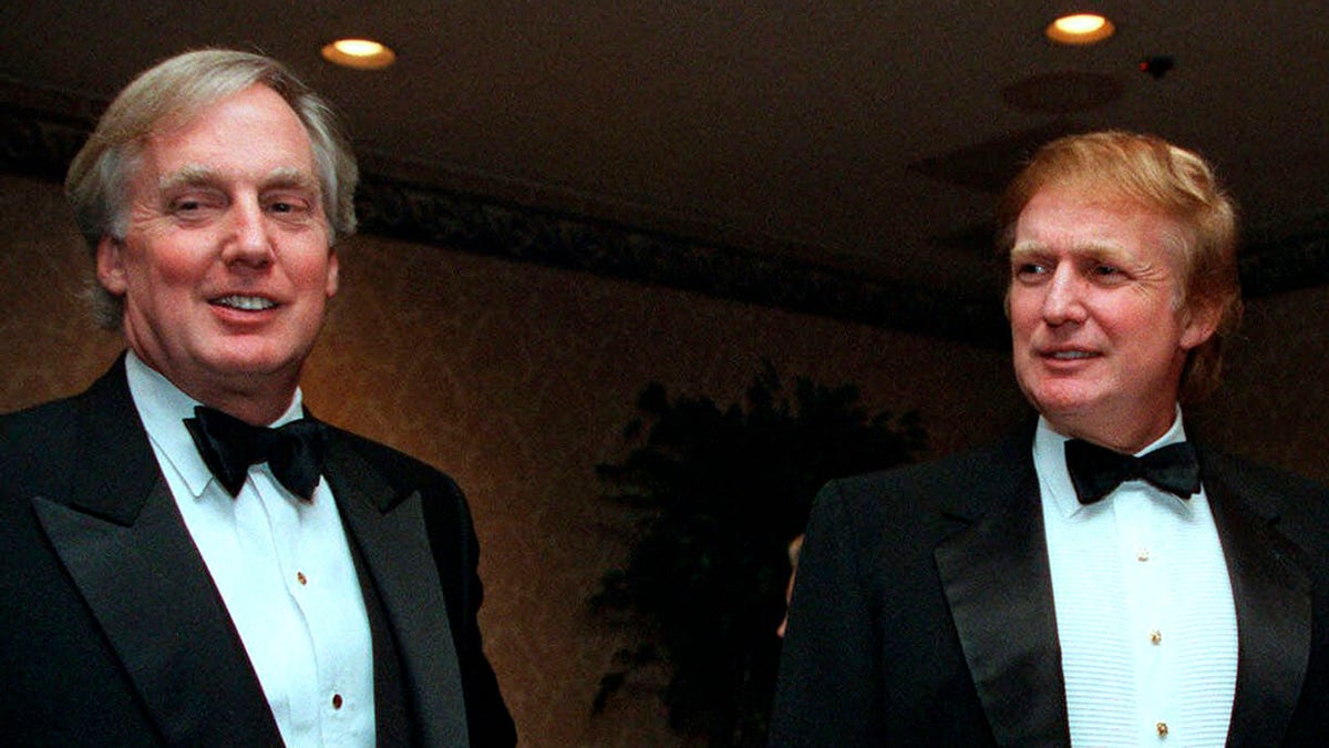 Robert Trump, left, joins brother Donald Trump at an event in New York City, Nov. 3,1999. (Associated Press)