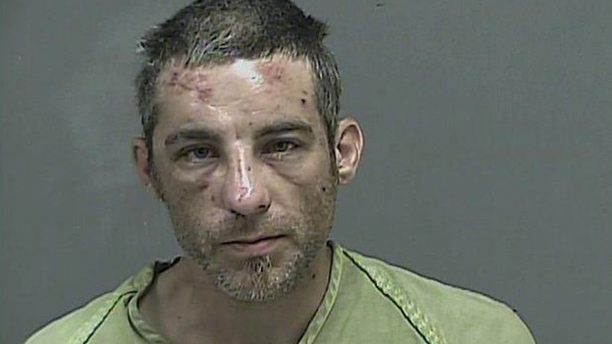 Alex Jessee, 36, was arrested Saturday after allegedly biting off the top of a police officer's pinkie finger in Tennessee, authorities say. (Kingsport Police Department)