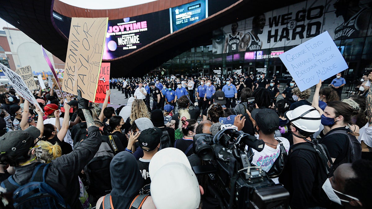 Protesters rally at the Barclays Center over the death of George Floyd, a black man who was in police custody in Minneapolis Friday, May 29, 2020, in the Brooklyn borough of New York. Floyd died after being restrained by Minneapolis police officers on Memorial Day. (AP Photo/Frank Franklin II)