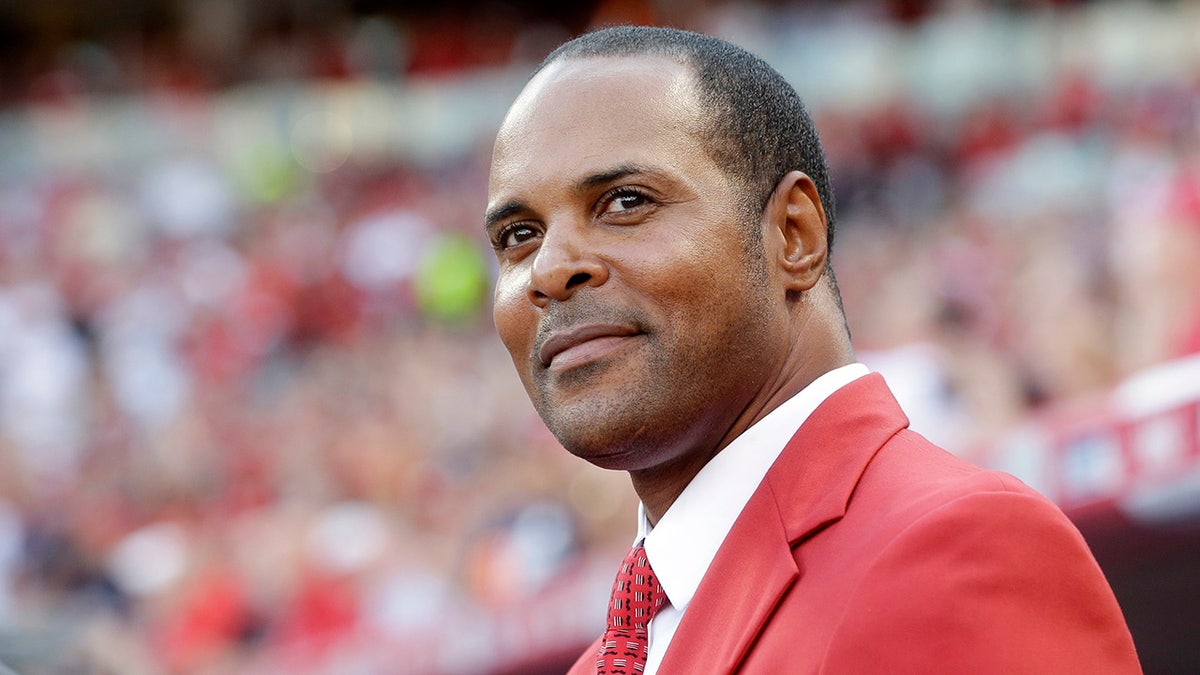 Barry Larkin is introduced before the MLB All-Star baseball game in Cincinnati. Something still bothers Barry Larkin about his Most Valuable Player award. The other name engraved on the trophy: Kenesaw Mountain Landis. “Why is it on there?” said Larkin, the black shortstop voted National League MVP in 1995 with the Cincinnati Reds. (AP Photo/John Minchillo, File)