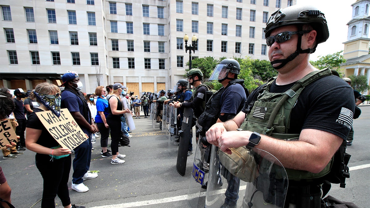 Demonstrators protest the death of George Floyd, Wednesday, June 3, 2020, near the White House in Washington. Floyd died after being restrained by Minneapolis police officers. (AP Photo/Manuel Balce Ceneta)