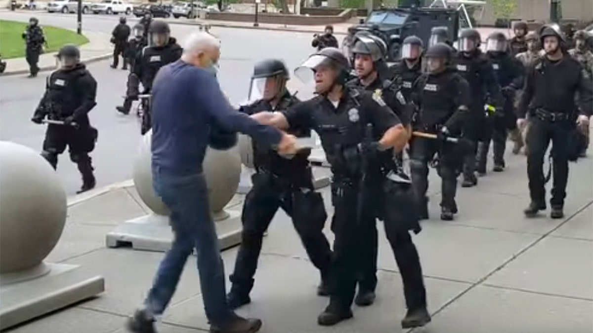 In this image from video provided by WBFO, a Buffalo police officer appears to shove a man who walked up to police Thursday, June 4, 2020, in Buffalo, N.Y.