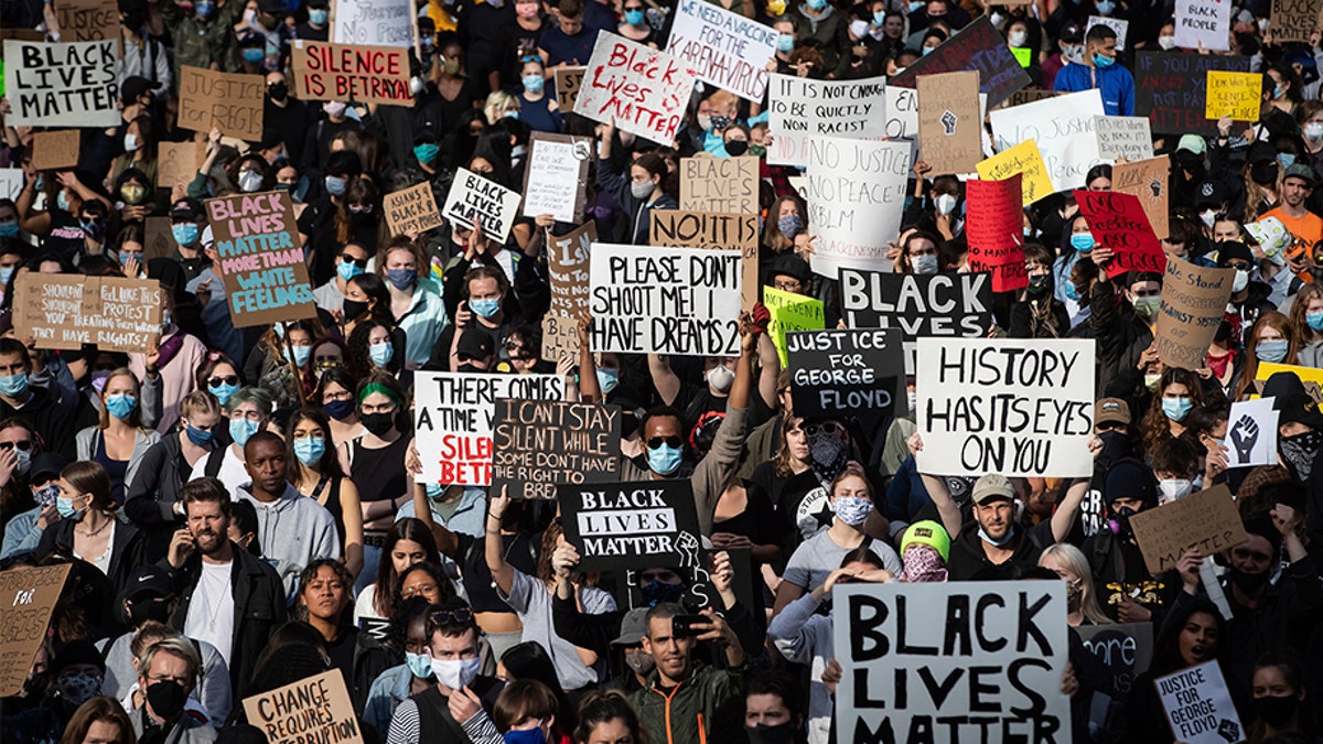 Thousands of people gather for a peaceful demonstration in support of George Floyd and Regis Korchinski-Paquet and protest against racism, injustice and police brutality, in Vancouver, on Sunday, May 31, 2020. (Darryl Dyck/The Canadian Press via AP)