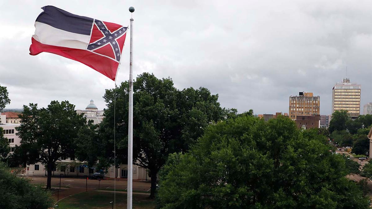 A Mississippi state flag flies outside the Capitol in Jackson, Miss., Thursday, June 25, 2020.