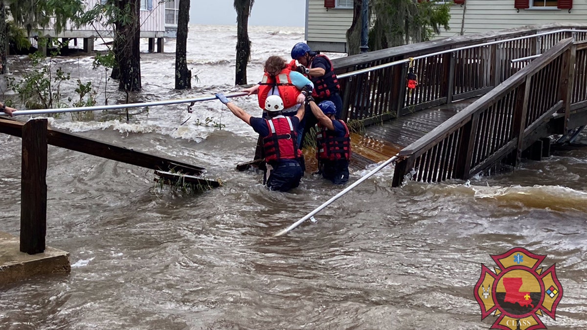 A rescue on Monday in Mandeville, La. after storm surge flooding from Tropical Depression Cristobal.