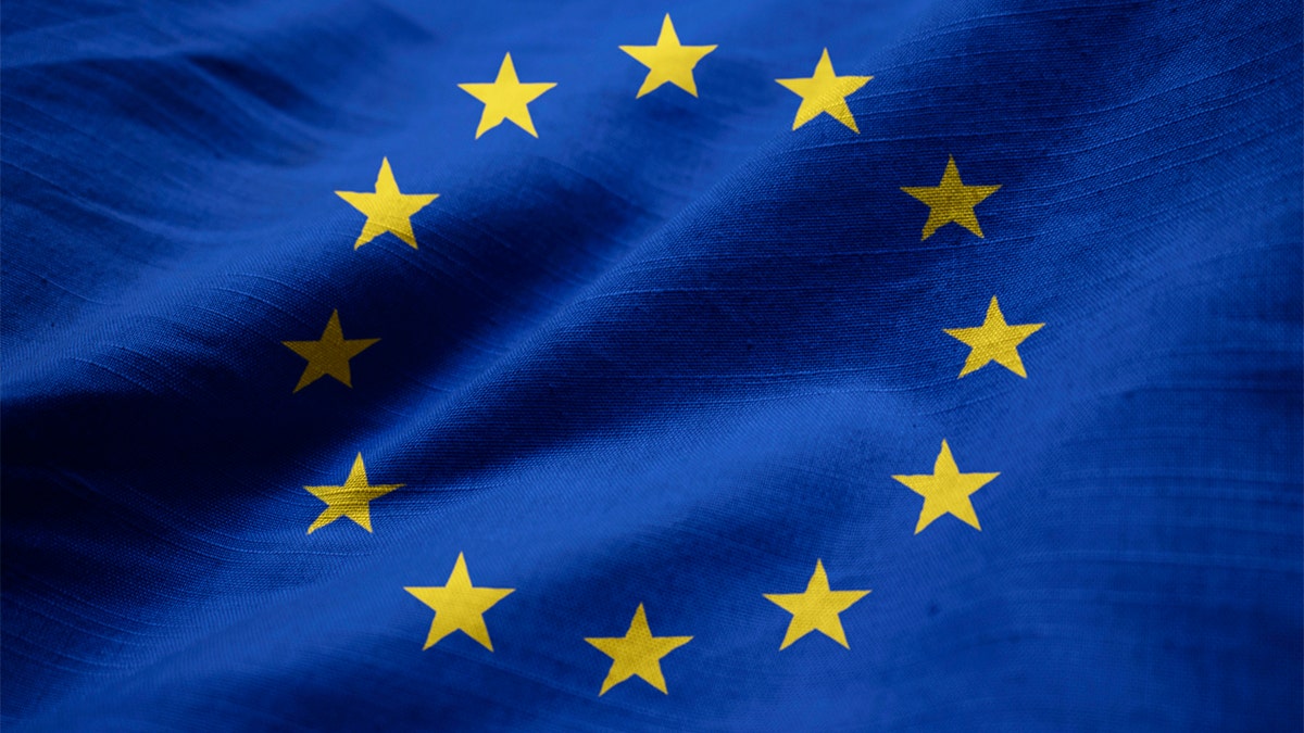 Closeup of Ruffled European Union Flag, European Union Flag Blowing in Wind. The EU is considering prohibiting Americans from traveling to its member countries as it begins to reopen its borders over coronavirus conditions in the United States.