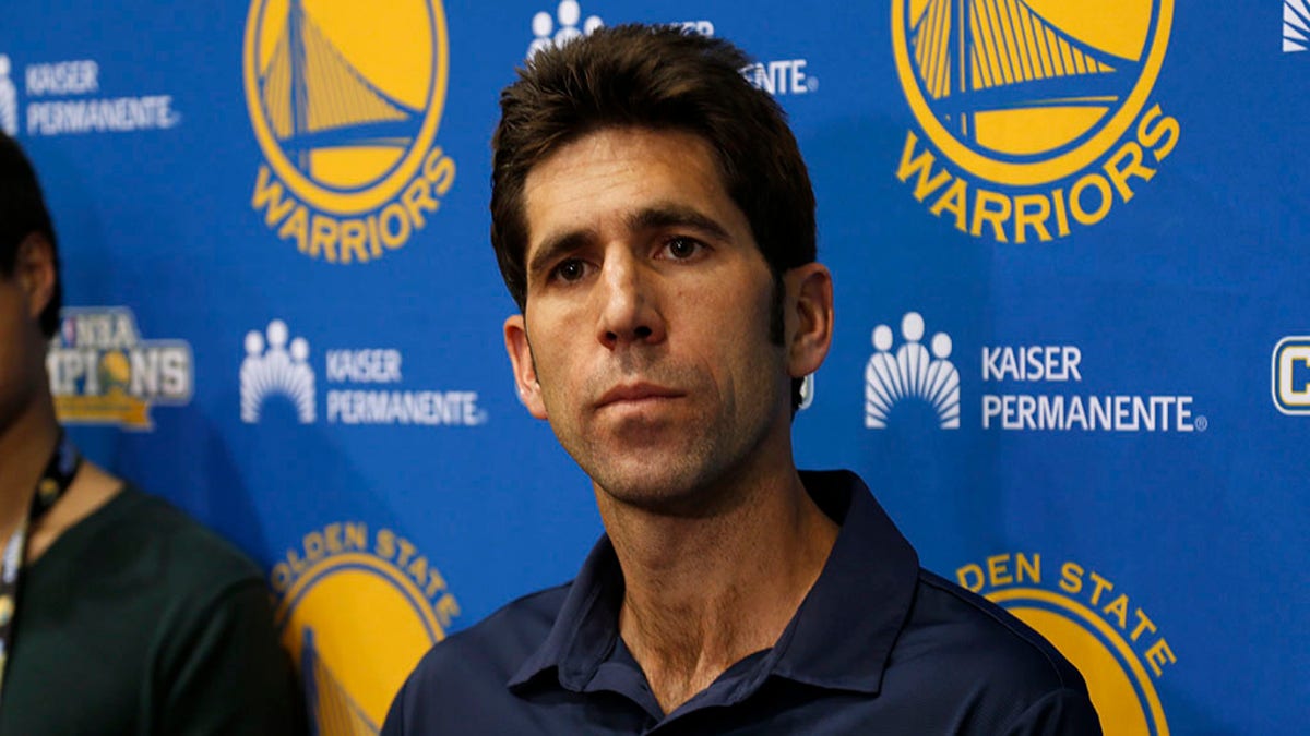 Golden State Warriors general manager Bob Myers, right, watches