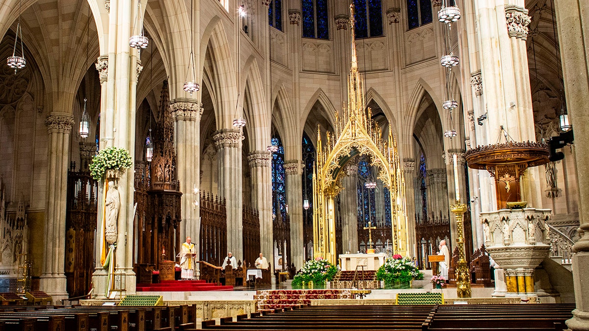 Cardinal Timothy Dolan celebrates Easter Mass amid the Coronavirus pandemic in the near-empty St. Patrick's Cathedral on April 12, 2020 in New York City. (Photo by Kena Betancur / AFP) (Photo by KENA BETANCUR/AFP via Getty Images)