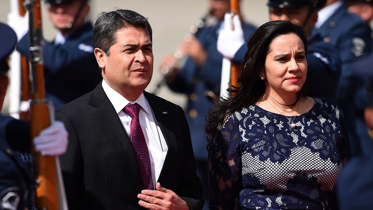 Honduran President Juan Orlando Hernandez (L) and his wife Ana Garcia have both tested for coronavirus. (Photo by Diana Sanchez / AFP) (Photo credit should read DIANA SANCHEZ/AFP via Getty Images)