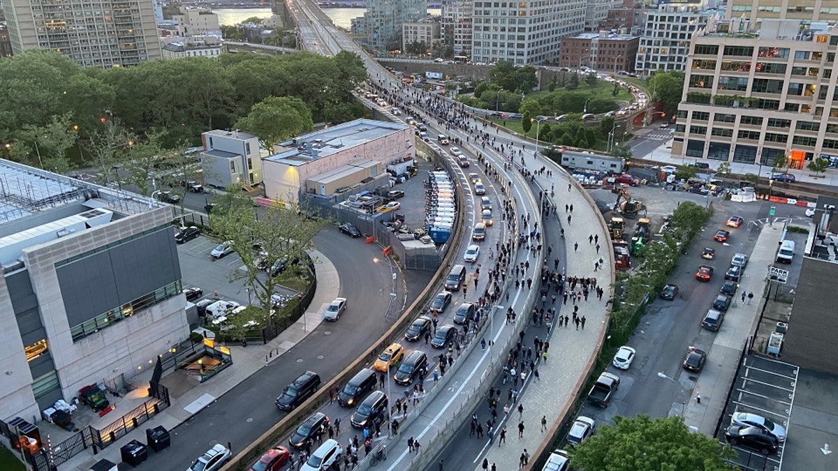 Hundreds of protestors streamed across the Brooklyn Bridge toward Manhattan on Monday night chanting "Whose streets? Our streets!"