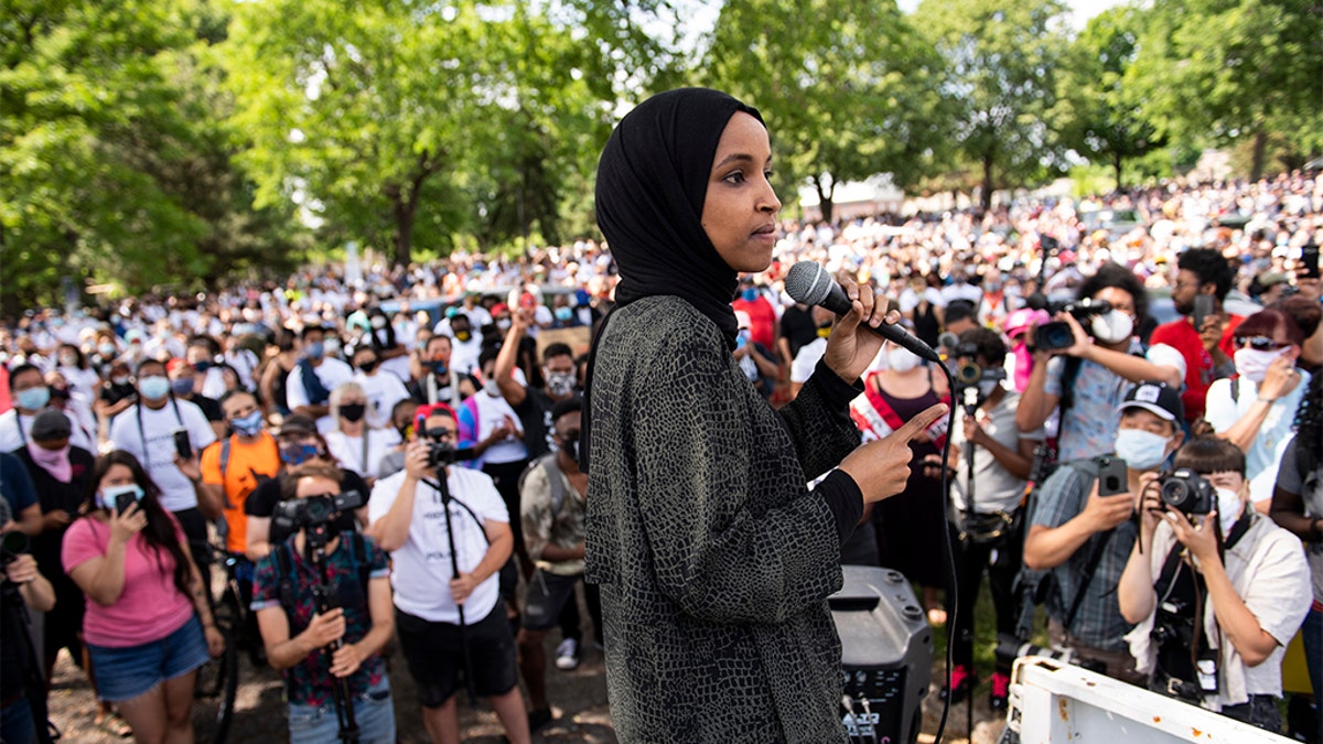 Rep. Ilhan Omar speaking to a crowd gathered for a march to defund the Minneapolis Police Department on Saturday. (Stephen Maturen/Getty Images)