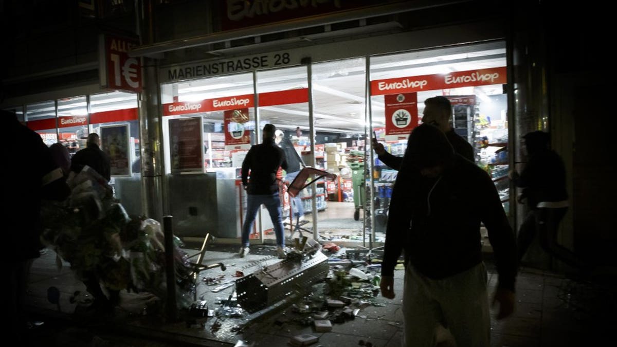 Goods lie on the floor after people broke into a shop on Marienstrasse in Stuttgart, Germany, Sunday, June 21, 2020. Dozens of violent small groups devastated downtown Stuttgart on Sunday night and injured several police officers, German news agency DPA reported.