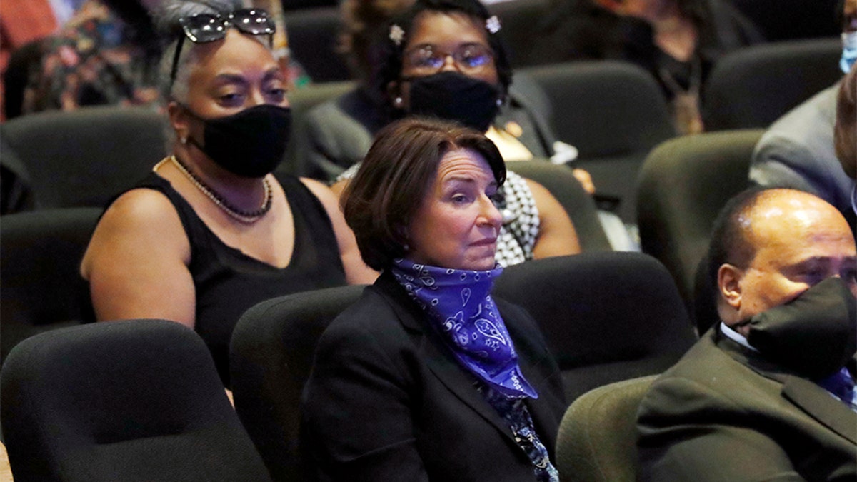 Sen. Amy Klobuchar, D-Minn., center sits among guests at North Central University Thursday, June 4, 2020, before a memorial service for George Floyd in Minneapolis. (AP Photo/Julio Cortez)