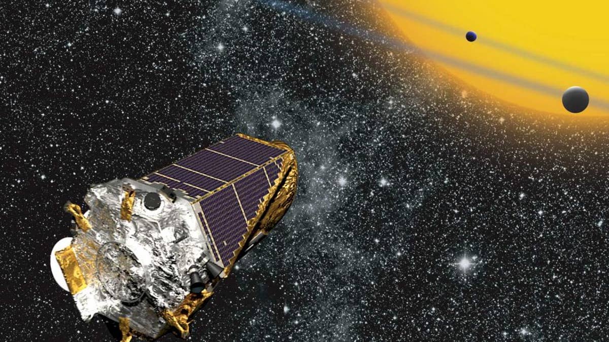 Artist’s conception of Kepler telescope observing planets transiting a distant star (Credit: NASA Ames/W Stenzel).