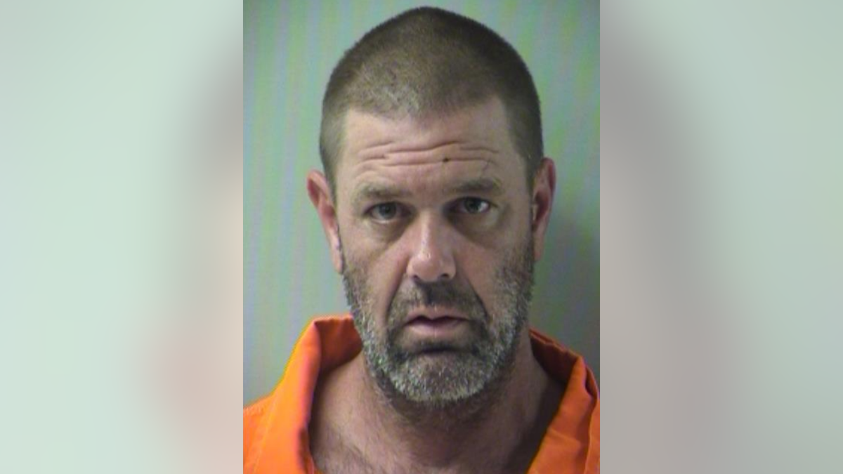 Mathew Ross Peters, 42, was arrested on Tuesday after allegedly shooting a cyclist in the head with a crossbow.