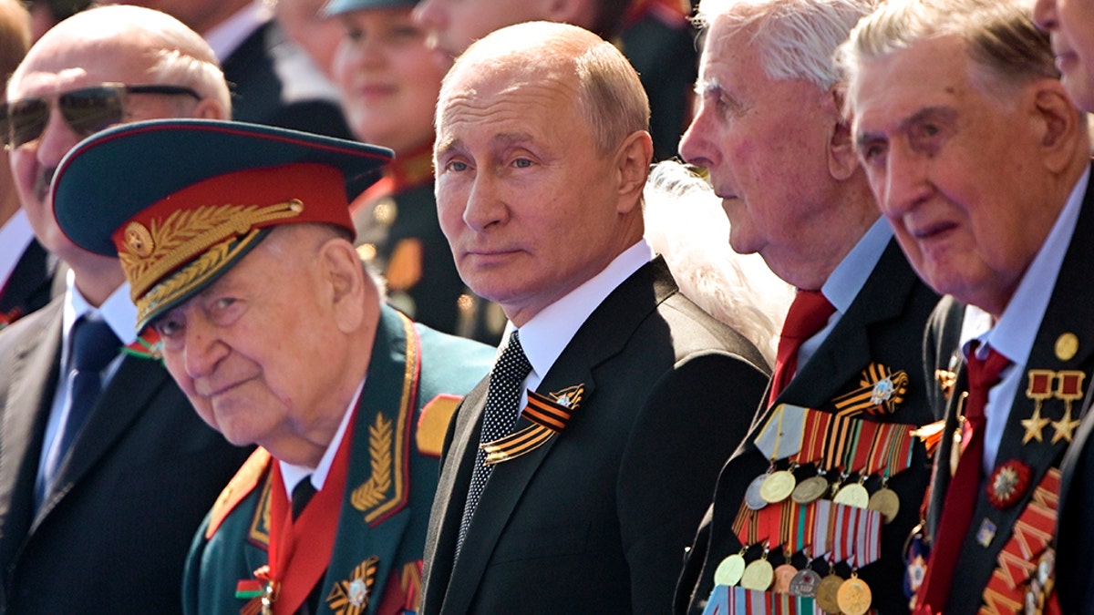 Russian President Vladimir Putin, center, watches the Victory Day military parade marking the 75th anniversary of the Nazi defeat in Moscow, June 24, 2020. (Associated Press)
