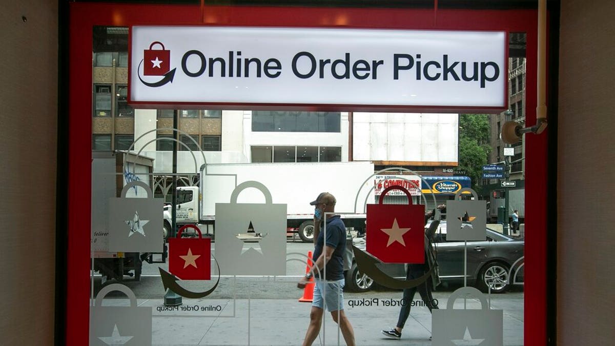 Pedestrians pass the online order pickup area at the Macy's Herald Square location Friday, June 19, 2020, in New York. New York City hits a key point Monday in trying to rebound from the nation’s deadliest coronavirus outbreak. (AP Photo/Frank Franklin II)