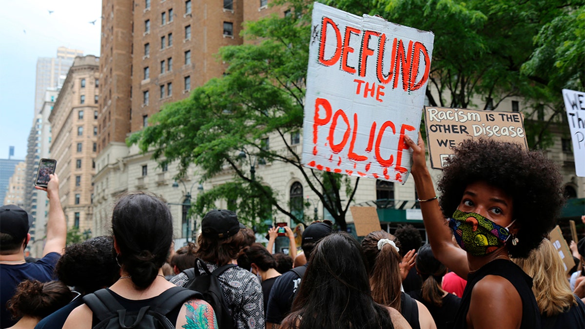 Protesters march Saturday, June 6, 2020, in New York. Demonstrations continue across the United States in protest of racism and police brutality, sparked by the May 25 death of George Floyd in police custody in Minneapolis. (AP Photo/Ragan Clark)