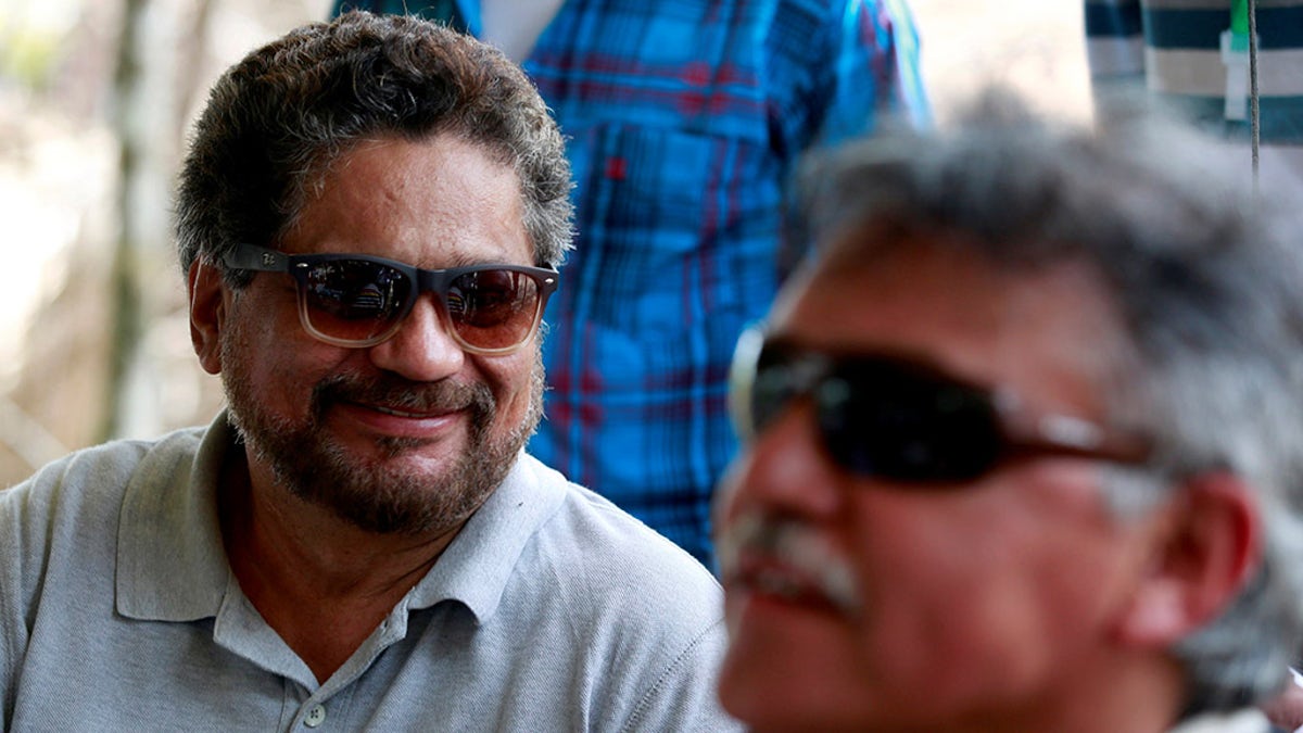 Ivan Marque (L) and Jesus Santrich, members of the Revolutionary Armed Forces of Colombia (FARC), talk to the media during the congress at the camp where they will ratify a peace deal with the government, near El Diamante in Yari Plains, Colombia, September 21, 2016. REUTERS /John Vizcaino - S1BEUCPYDBAA