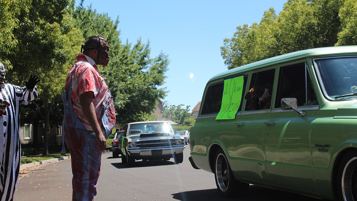 The social distance parade included cars and creepy clowns to celebrate with Brodie.