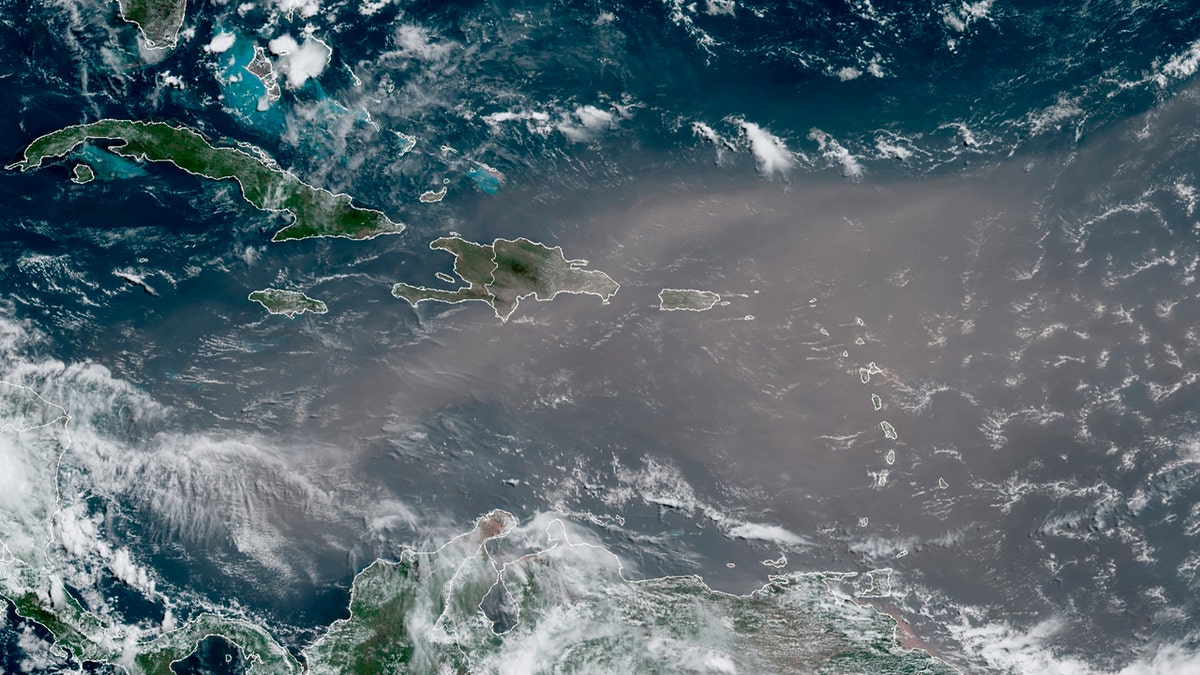 This satellite photo provided by the National Oceanic and Atmospheric Administration, NOAA, shows a could of dust coming from the Sahara desert arriving to the Caribbean Monday, June 22, 2020.