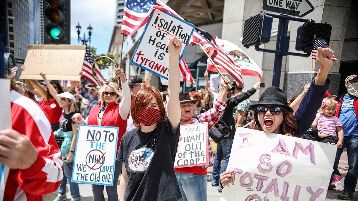 Demonstrators protest during a "Freedom Rally" against Stay-At-Home Directives on April 18, 2020 in San Diego, California.