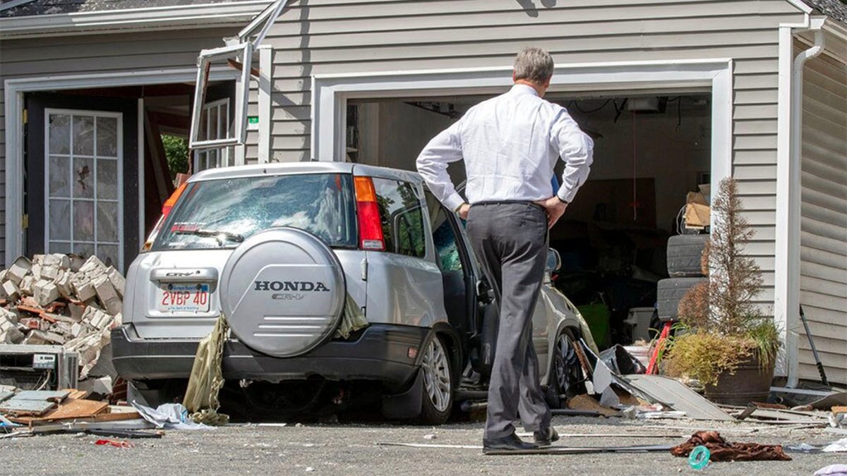 Massachusetts Gov. Charlie Baker tours the site where an 18-year-old man was killed during a gas explosion in Lawrence, Mass., Sept. 14, 2018. (AP Photo)