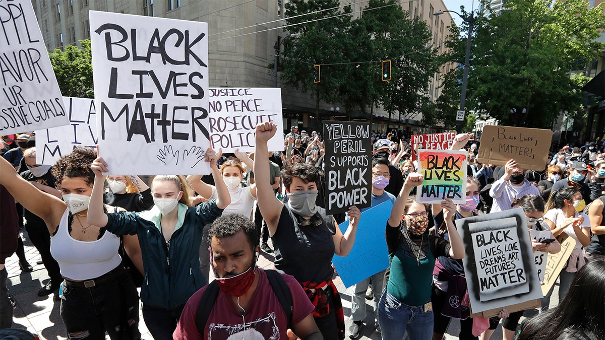 Demonstrators fill a downtown street Monday, June 1, 2020, in Seattle, following protests over the weekend over the death of George Floyd, a black man who was in police custody in Minneapolis. (AP Photo/Elaine Thompson)