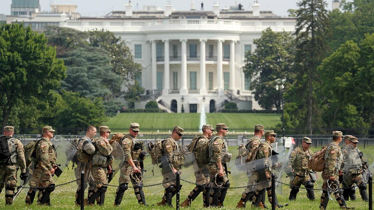 Uniformed military personnel walk in front of the White House ahead of a protest against racial inequality in the aftermath of the death in Minneapolis police custody of George Floyd, in Washington, U.S. June 6, 2020. 