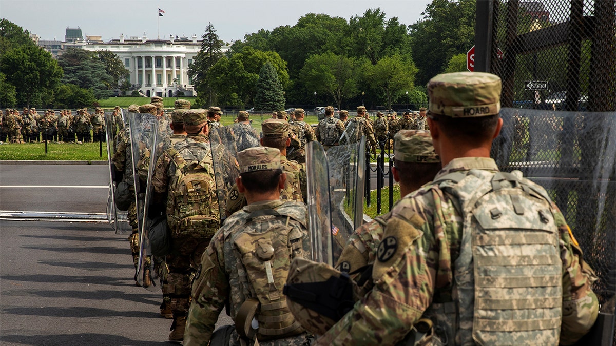 Uniformed military personnel walks into the secured White House area ahead of a protest against racial inequality in reaction to the death in Minneapolis police custody of George Floyd, in Washington, U.S., June 6, 2020. 