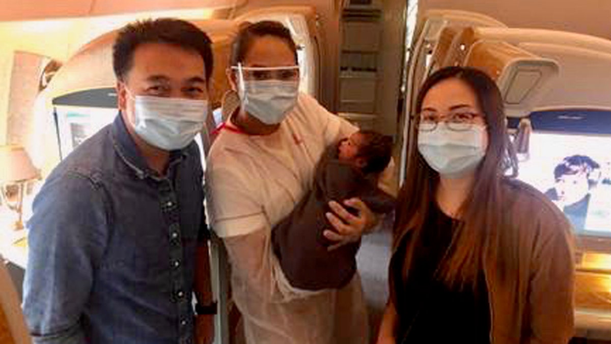 Nurses Christine Anne and John were being repatriated from the Carnival Breeze cruise ship on Saturday when they helped deliver a baby at 37,000 feet.