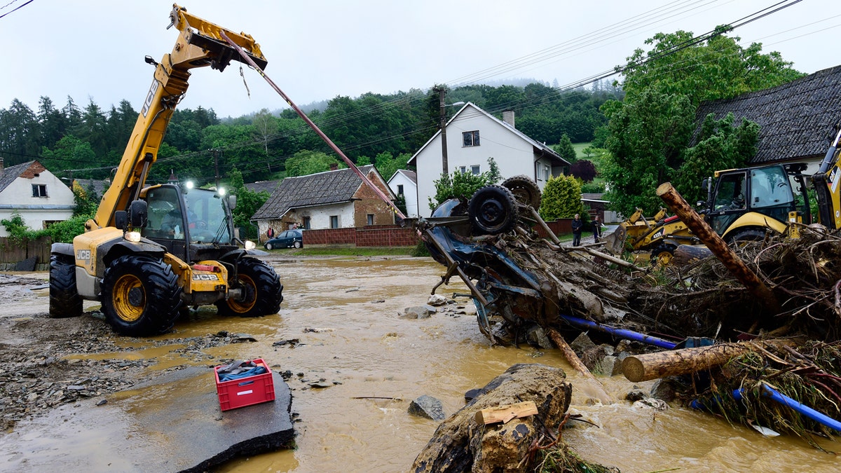 At least one person died, another is missing and dozens were rescued amid flash flooding in the northeastern Czech Republic.