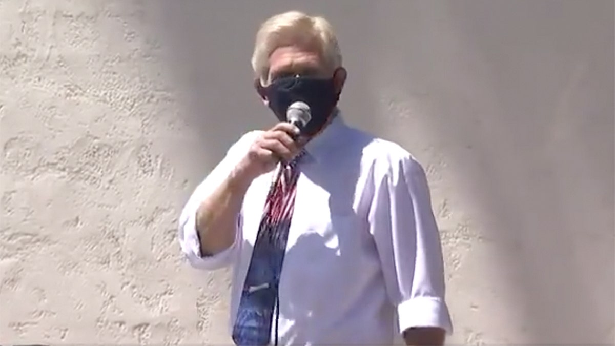 Scottsdale City Council member Guy Phillips chanted “I can’t breathe!” before ripping off his face mask in front of a crowd of about 200 attending an “Unmask Us” protest.<br>