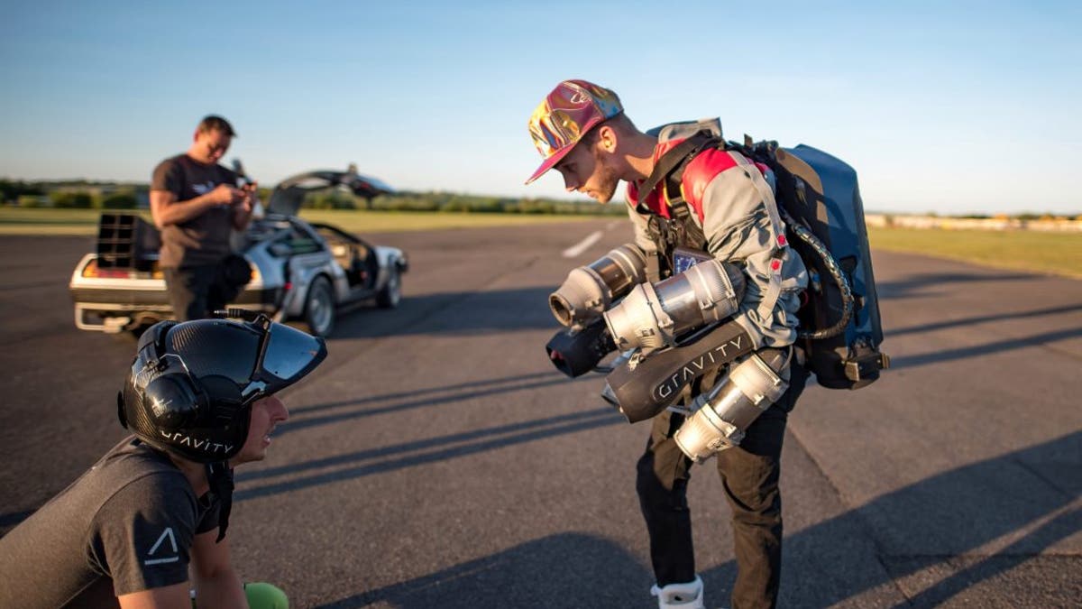 Sam Rogers, 24, lived out a childhood dream and became a real-life Marty McFly when he took to the skies with the help of a 3D-printed jetsuit. Breathtaking footage shows the sci-fi fan flying through the air along an airport runway at sunset while wearing the $432,000 jetpack. (Credit: SWNS)
