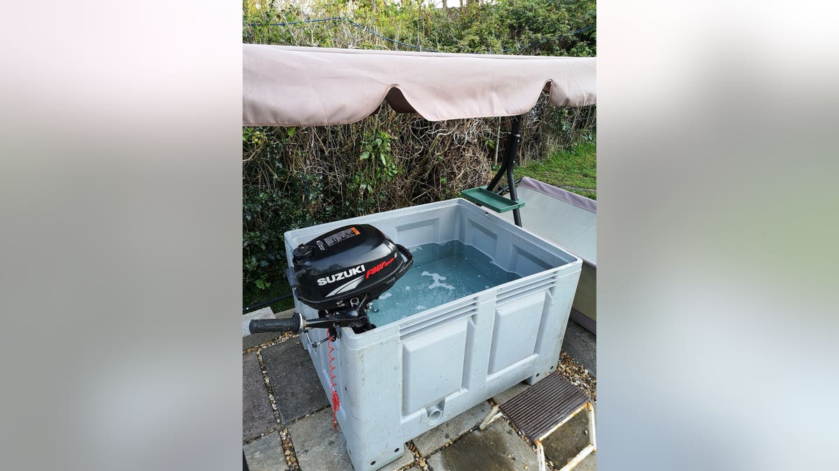 The water is cleaned using the old fish pond filtration system, which he runs through 66-feet of hose pipe sitting on his concrete path, to heat the water.