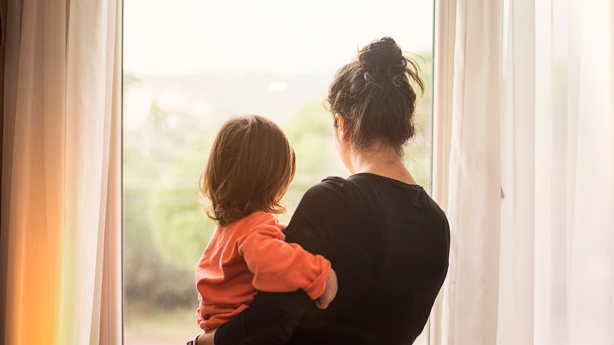 Mom holding child