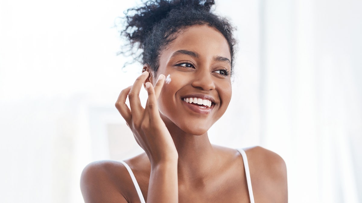 Moisturizing creams can improve the skin barrier and minimize irritation from face masks, experts say. (iStock)