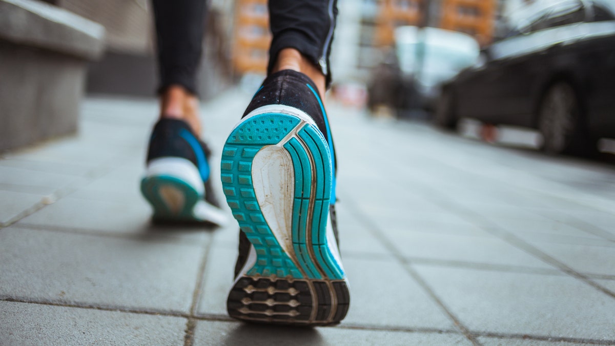 Close up shot of runner's shoes.