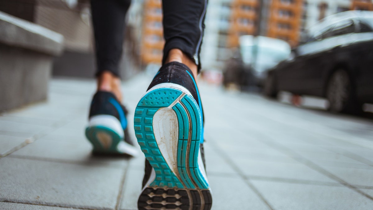 Close up shot of runner's shoes.
