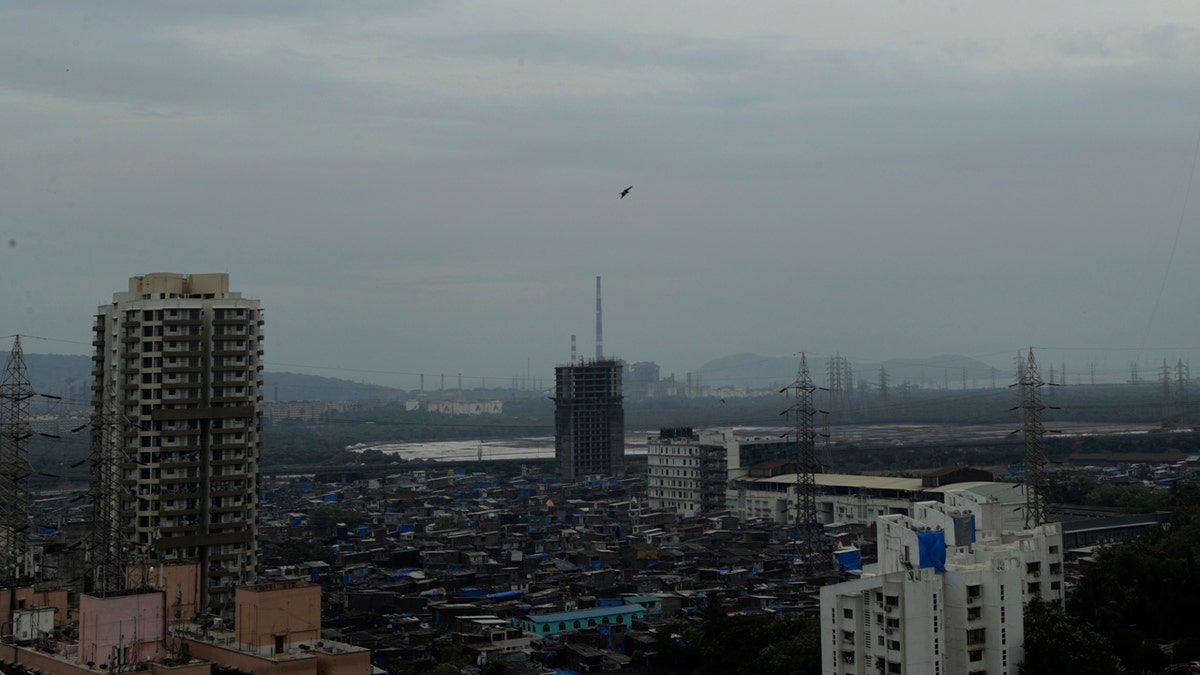 Dark clouds gather over the skyline in Mumbai, India, Tuesday, June 2, 2020.