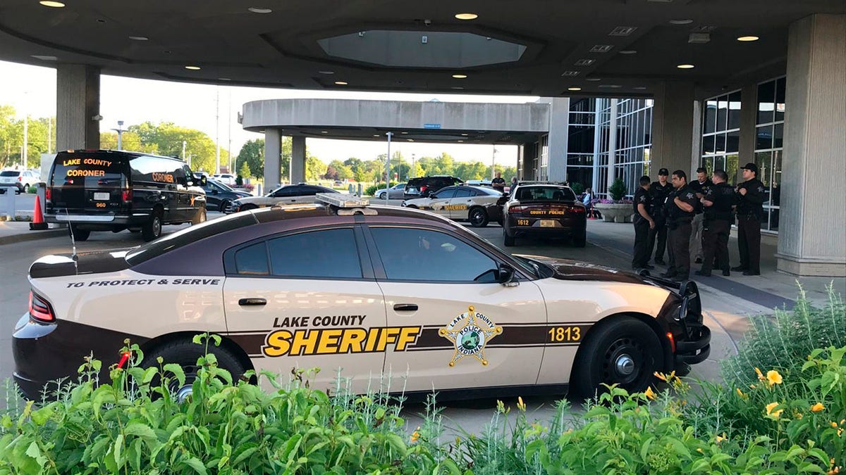 Lake County Sheriff's squad cars are parked outside of Community Hospital in Munster, Ind., Tuesday, June 16, as a fatal shooting investigation is conducted. (Lucas Gonzalez/The Times via AP)