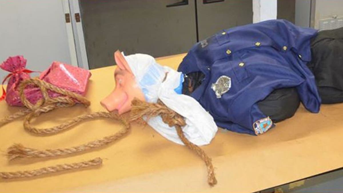 A mannequin dressed in an NYPD shirt and wearing a mask was found hanging off a Florida interstate.