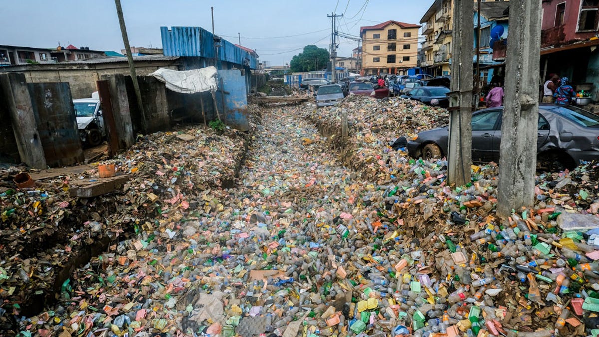 Garbage piles cover fields and streets after heavy rainfall in Lagos, Nigeria on June 7.