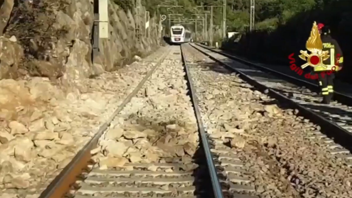 A commuter train in Italy derailed after striking boulders on the tracks after a landslide on Monday.